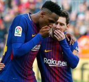 Yerry Mina y Lionel Messi. AFP