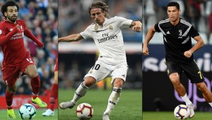 El croata Luka Modric (centro) fue elegido recientemente como mejor centrocampista y mejor jugador para la Uefa. AFP