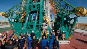 Momento en el que los astronautas se despedían para partir.
AFP