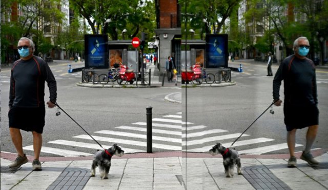 Esta imagen, tomada el 2 de mayo en Madrid, muestra a un hombre con mascarilla sanitaria caminando con un perro, durante la primera jornada en la que se permitió a los españoles pasear o hacer deporte después de 48 días de confinamiento obligatorio.
AFP
